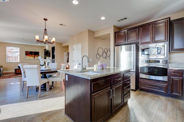 Chandelier, Dining room, Interior, Kitchen, Recessed Lighting, Stainless Steel Appliances, Wood Texture Flooring