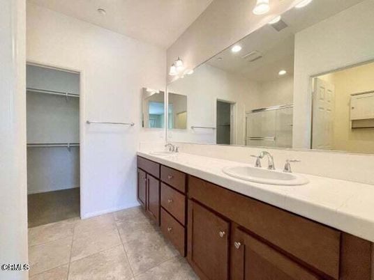 Bathroom, Dual Sink Vanities, Glass Shower, Interior, Recessed Lighting, Tile Countertops, Walk-in Closets
