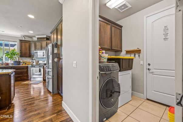 Interior, Kitchen, Recessed Lighting, Washer, Wood Texture Flooring