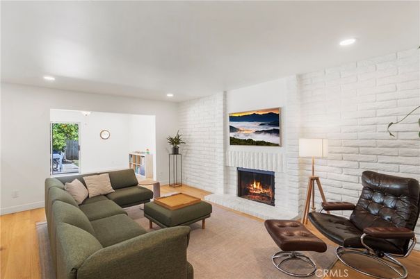 Fireplace, Interior, Living room, Recessed Lighting, Stone Walls, Wood Texture Flooring