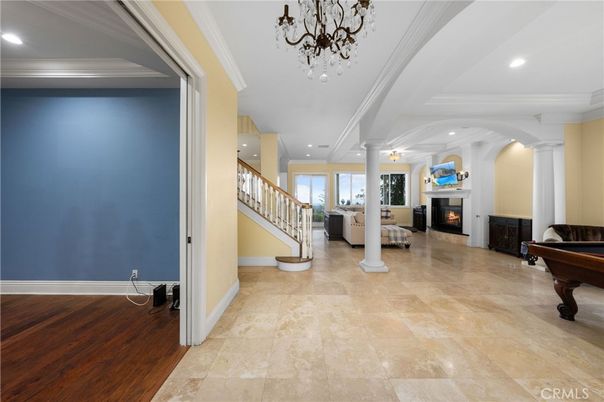 Chandelier, Fireplace, Interior, Living room, Piano, Recessed Lighting, Wood Texture Flooring