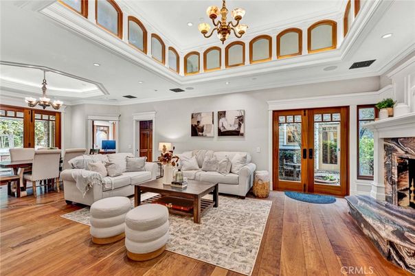 Chandelier, Dining room, Fireplace, Interior, Living room, Recessed Lighting, Wood Texture Flooring