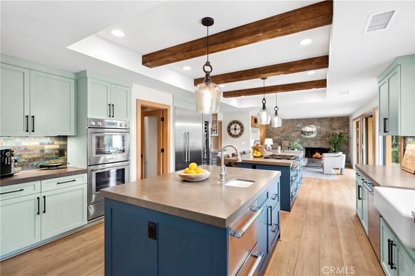 Fireplace, Interior, Kitchen, Pendant Lights, Recessed Lighting, Stainless Steel Appliances, Stone Walls, Wooden Beams, Wood Texture Flooring