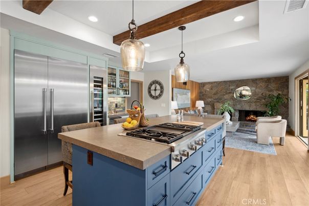 Fireplace, Interior, Kitchen, Living room, Pendant Lights, Recessed Lighting, Stainless Steel Appliances, Stone Walls, Wood Texture Flooring
