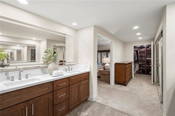 Bathroom, Dual Sink Vanities, Interior, Recessed Lighting, Walk-in Closets, Wood Texture Flooring