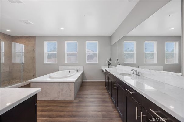 Bathroom, Dual Sink Vanities, Glass Shower, Interior, Recessed Lighting, Wood Texture Flooring