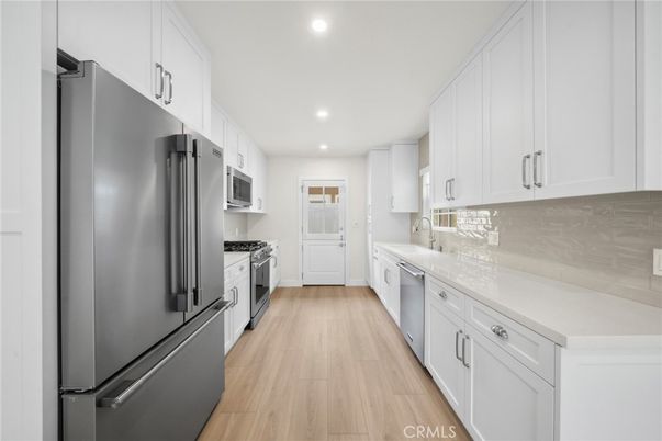 Interior, Kitchen, Recessed Lighting, Stainless Steel Appliances, Wood Texture Flooring