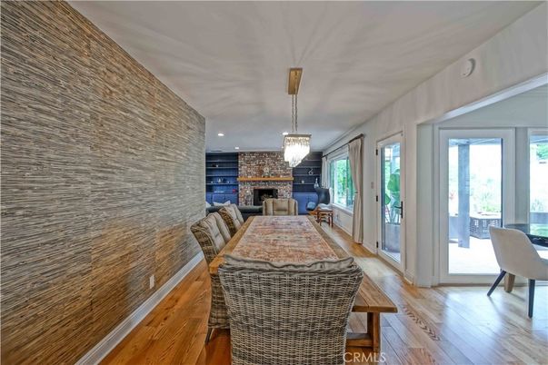 Chandelier, Dining room, Fireplace, Interior, Recessed Lighting, Stone Walls, Wood Texture Flooring