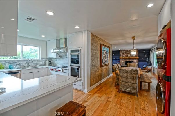 Dining room, Interior, Kitchen, Pendant Lights, Recessed Lighting, Stainless Steel Appliances, Stone Walls, Wood Texture Flooring
