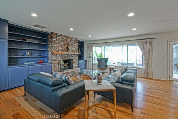 Fireplace, Interior, Living room, Recessed Lighting, Stone Walls, Wood Texture Flooring