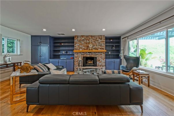 Fireplace, Interior, Living room, Recessed Lighting, Stone Walls, Wood Texture Flooring
