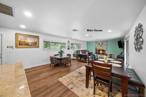 Dining room, Fireplace, Interior, Living room, Recessed Lighting, Wood Texture Flooring