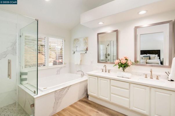 Bathroom, Bedroom, Dual Sink Vanities, Glass Shower, Interior, Marble Walls, Recessed Lighting, Wood Texture Flooring