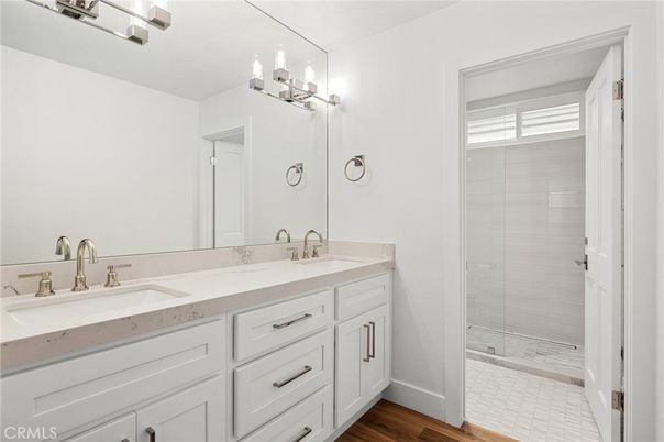 Bathroom, Dual Sink Vanities, Glass Shower, Interior, Wood Texture Flooring