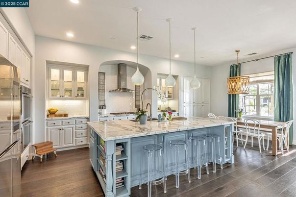 Dining room, Interior, Kitchen, Pendant Lights, Recessed Lighting, Stainless Steel Appliances, Wood Texture Flooring