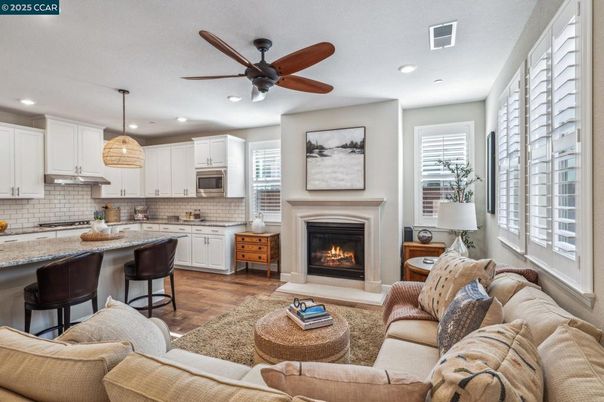 Fireplace, Interior, Kitchen, Living room, Pendant Lights, Recessed Lighting, Stainless Steel Appliances, Wood Texture Flooring