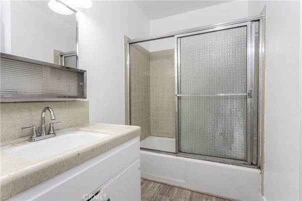 Bathroom, Glass Shower, Interior, Tile Countertops, Wood Texture Flooring