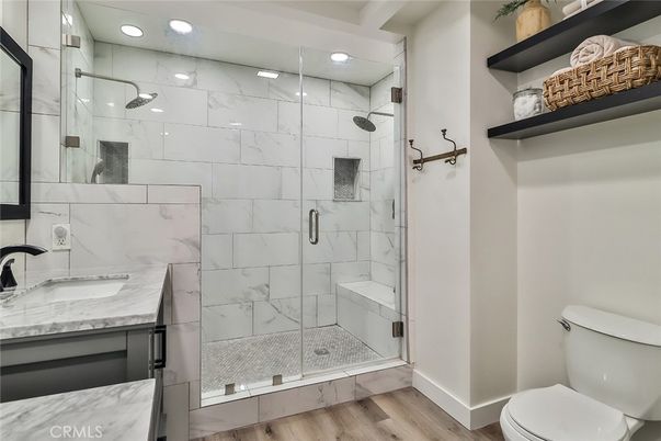 Bathroom, Glass Shower, Interior, Marble Walls, Recessed Lighting, Wood Texture Flooring