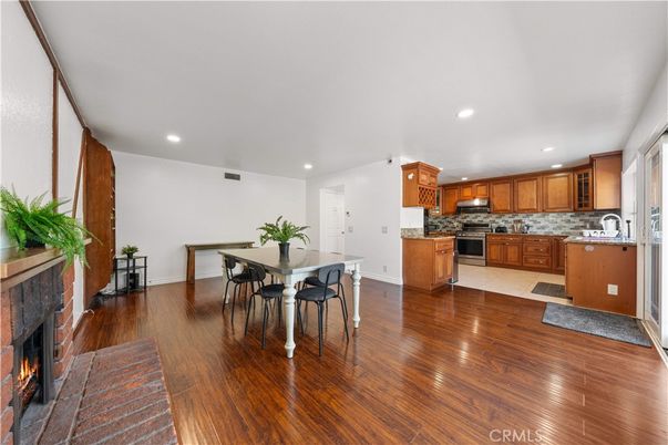 Dining room, Fireplace, Interior, Kitchen, Recessed Lighting, Wood Texture Flooring