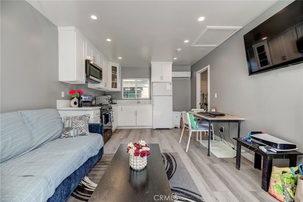 Dining room, Interior, Kitchen, Living room, Recessed Lighting, Stainless Steel Appliances, Wood Texture Flooring