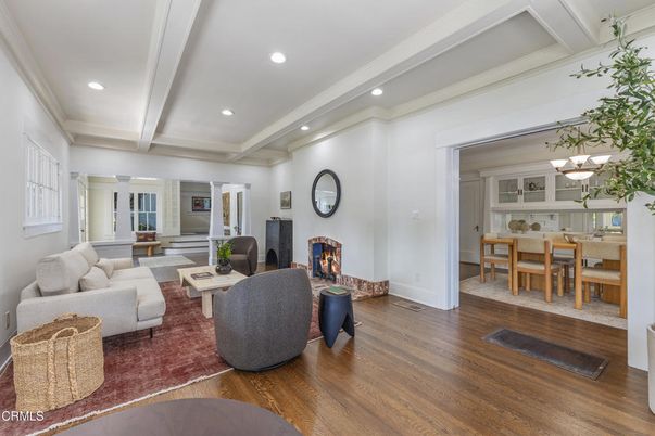 Chandelier, Dining room, Fireplace, Interior, Living room, Pendant Lights, Recessed Lighting, Wood Texture Flooring