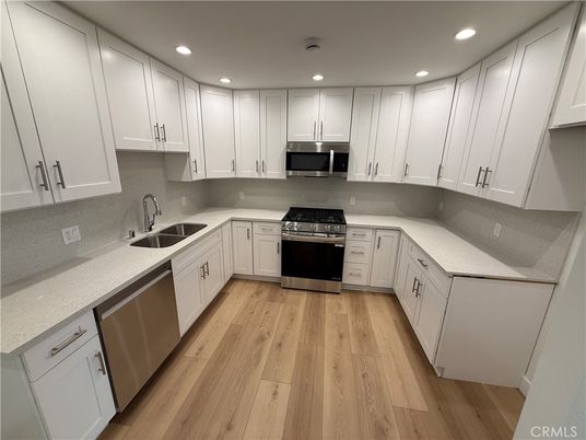 Interior, Kitchen, Recessed Lighting, Stainless Steel Appliances, Wood Texture Flooring