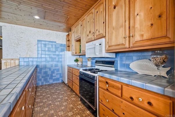 Interior, Kitchen, Recessed Lighting, Tile Countertops, Wooden Ceilings