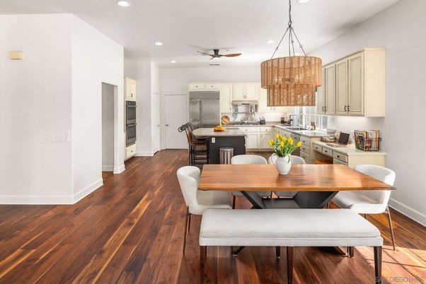 Chandelier, Dining room, Interior, Kitchen, Pendant Lights, Recessed Lighting, Stainless Steel Appliances, Wood Texture Flooring
