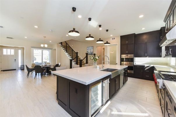 Dining room, Interior, Kitchen, Pendant Lights, Recessed Lighting, Stainless Steel Appliances, Wood Texture Flooring