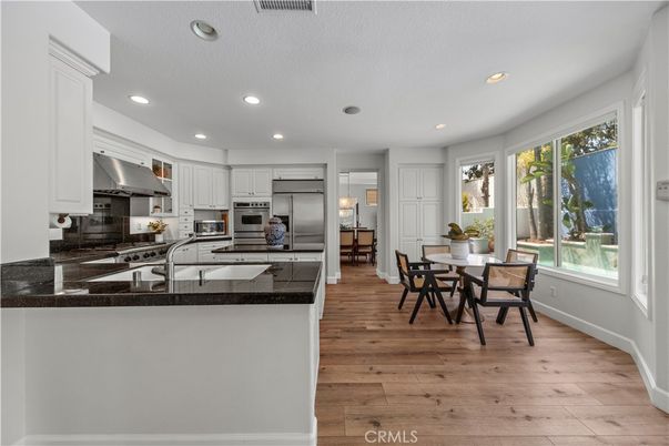 Dining room, Interior, Kitchen, Recessed Lighting, Stainless Steel Appliances, Wood Texture Flooring