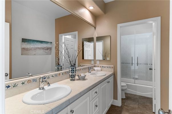 Bathroom, Dual Sink Vanities, Glass Shower, Interior, Recessed Lighting, Tile Countertops