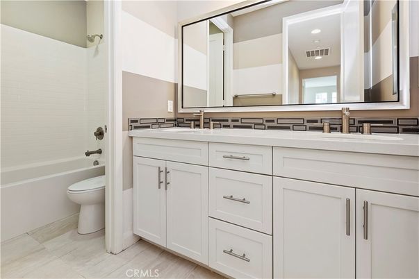 Bathroom, Dual Sink Vanities, Interior, Recessed Lighting, Wood Texture Flooring