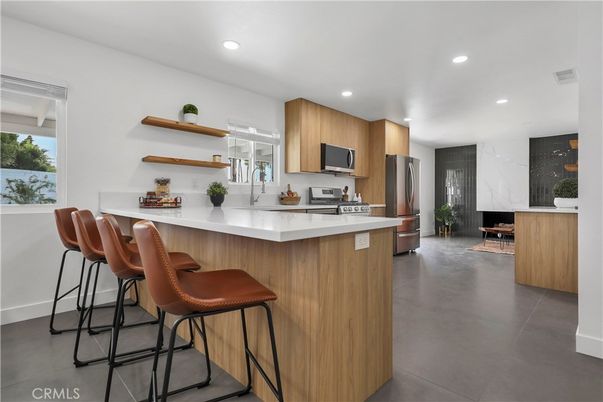 Interior, Kitchen, Marble Walls, Recessed Lighting, Stainless Steel Appliances