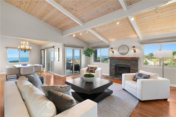 Chandelier, Dining room, Fireplace, Interior, Living room, Water, Wooden Ceilings, Wood Texture Flooring
