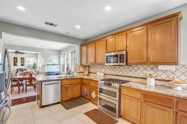 Dining room, Interior, Kitchen, Recessed Lighting, Stainless Steel Appliances, Wood Texture Flooring