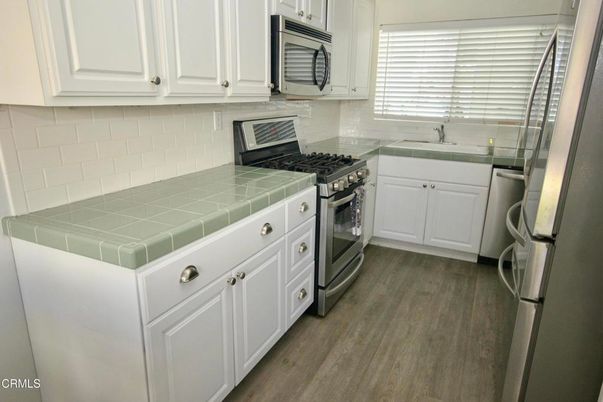 Interior, Kitchen, Tile Countertops, Wood Texture Flooring