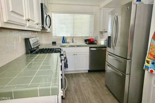 Interior, Kitchen, Stainless Steel Appliances, Tile Countertops, Wood Texture Flooring