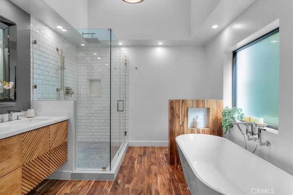Bathroom, Dual Sink Vanities, Free Standing Baths, Glass Shower, Interior, Recessed Lighting, Wood Texture Flooring
