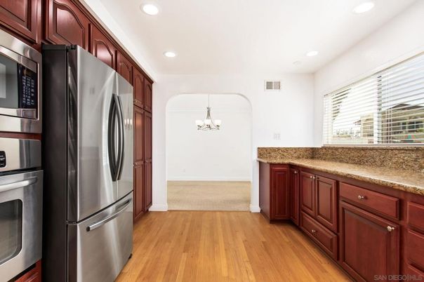 Chandelier, Interior, Kitchen, Recessed Lighting, Stainless Steel Appliances, Washer, Wood Texture Flooring
