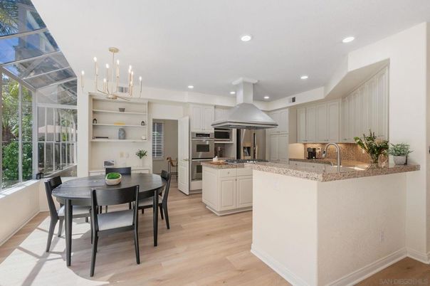 Dining room, Interior, Kitchen, Pendant Lights, Recessed Lighting, Stainless Steel Appliances, Wood Texture Flooring