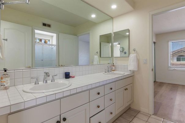 Bathroom, Dual Sink Vanities, Interior, Recessed Lighting, Tile Countertops, Wood Texture Flooring