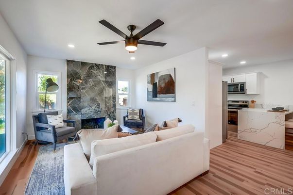Fireplace, Interior, Kitchen, Living room, Marble Walls, Recessed Lighting, Stainless Steel Appliances, Wood Texture Flooring