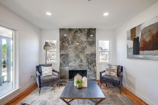 Fireplace, Interior, Living room, Marble Walls, Recessed Lighting, Wood Texture Flooring