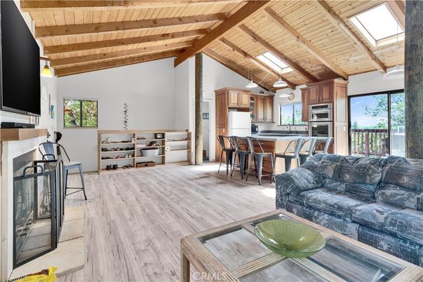 Dining room, Fireplace, Interior, Kitchen, Living room, Pendant Lights, Stainless Steel Appliances, Wooden Beams, Wooden Ceilings, Wood Texture Flooring