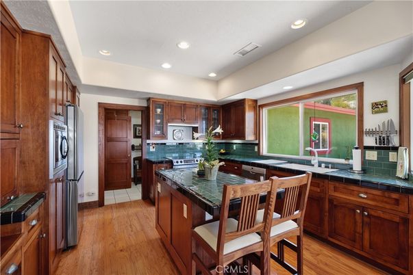 Interior, Kitchen, Recessed Lighting, Tile Countertops, Wood Texture Flooring