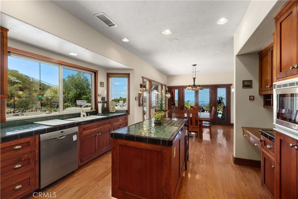 Dining room, Interior, Kitchen, Pendant Lights, Recessed Lighting, Tile Countertops, Wood Texture Flooring