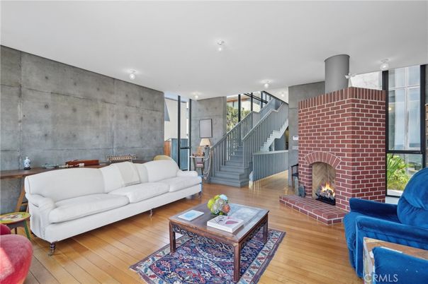 Dining room, Fireplace, Interior, Living room, Recessed Lighting, Stone Walls, Wood Texture Flooring