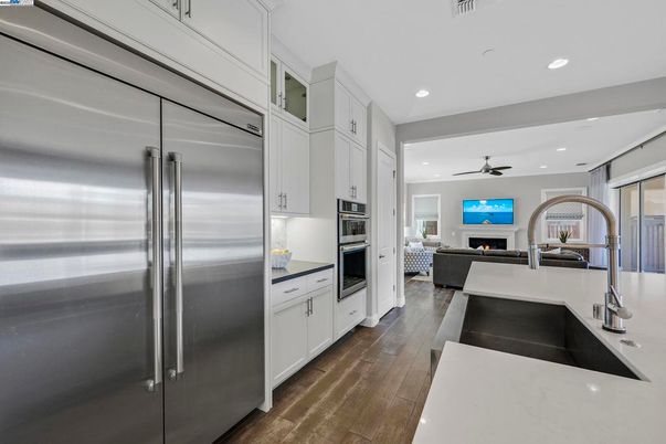 Fireplace, Interior, Kitchen, Living room, Recessed Lighting, Stainless Steel Appliances, Wood Texture Flooring