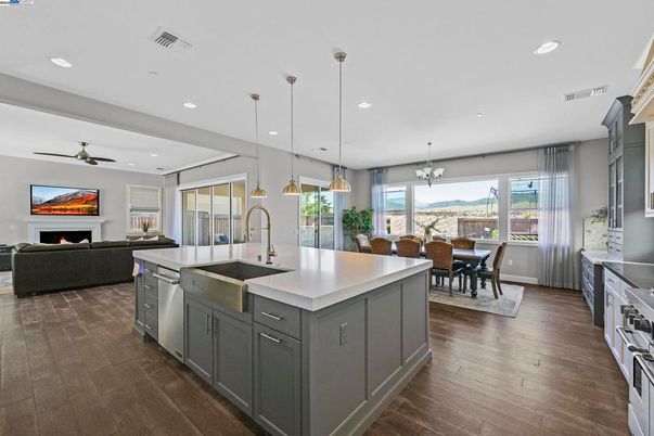 Dining room, Fireplace, Interior, Kitchen, Living room, Pendant Lights, Recessed Lighting, Stainless Steel Appliances, Wood Texture Flooring