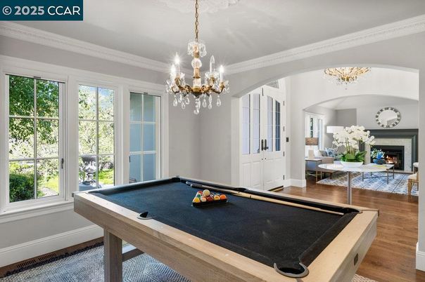 Billiard Table, Chandelier, Fireplace, Game Room, Interior, Wood Texture Flooring